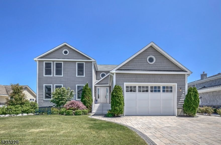 In the much sought-after neighborhood of Curtis Point, this beautiful waterfront property sits on .2 acres. It features a large open floor plan and oversized deck with salt water pool, 70' dock space and water craft lifts that fit two WaveRunners. The front lawn and landscaped gardens at both front and back outdoor spaces create a relaxing and peaceful ambience. The kitchen is a dream come true for entertaining.