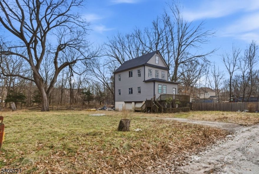 This property sits on an impressive 108 x 110 lot on a dead end, an exceptionally rare opportunity with endless potential. The home has been fully gutted down to the studs, providing a true blank canvas for your vision. Architectural drawings without approvals and a current survey are available to showcase the intended layout and future possibilities. The renovation was framed for a spacious three story open concept design featuring 5 bedrooms, 3 bathrooms, a 2 car garage, and a massive attic, with soaring volume ceilings on both levels. Surrounded by beautiful surroundings and offering tremendous flexibility, this property is ideal for a builder, contractor, or anyone seeking significant space, including car enthusiasts who value parking capacity and lot size. An exceptional opportunity to create something truly special.