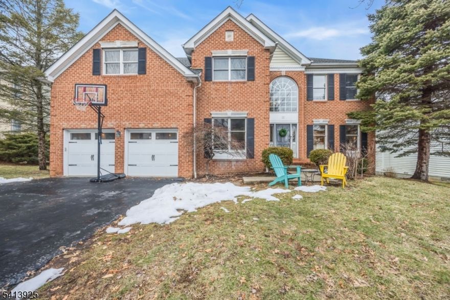 Welcome to 12 Sentinel Drive in the sought-after Patriot Ridge community of Basking Ridge, a stunning Colonial offering exceptional space, warmth, & functionality in one of Somerset County's most desirable neighborhoods. Designed for both everyday living & elegant entertaining, this home features rich wood flooring throughout & an expansive great room filled with natural light, decorative woodwork, vaulted ceilings, dual staircases, skylights, a 2-story foyer, rear deck, & patio. Two fireplaces create inviting gathering spaces, perfect for cozy evenings and memorable celebrations.The thoughtfully designed layout includes:  5 generously sized bedrooms, 4 full bathrooms plus a powder room, a dramatic great room ideal for entertaining, and a private office. A fully finished walkout basement offering flexible living space, is perfect for a recreation room, guest suite, or gym - seamlessly connecting indoor and outdoor living.  Kitchen appliances are less than 1-year, new cement base and flooring recently installed in basement. Located within the highly regarded Bernards Township School District and just minutes from downtown Basking Ridge, parks, shopping, dining, and commuter routes, this home offers the ideal balance of neighborhood charm and convenience.12 Sentinel Drive is where timeless design meets modern lifestyle -  an exceptional opportunity in Patriot Ridge.
