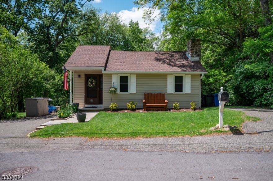 Please submit offers no later than Wednesday the 11th 5:00 - offer instructions in Media Welcome to the picture perfect cottage in the sought after Rock Ridge Lake. Main floor offers living room with hard wood floors and gas fireplace, fully renovated eat-in kitchen with granite countertops and new appliances, 2nd bedroom and full bath. Just a few steps down and you have the laundry room with second 1/2 bath and primary bedroom with sliding doors out to gorgeous wrap-around deck. Lower level offers large storage room and finished walk-out basement currently used as a home gym. The fully fenced in yard boasts a custom fire-pit and plenty of room for back yard games. There is natural gas in the street if you would like to convert from oil to gas. Neighborhood offers two lake options: Cook's Pond and Rock Ridge.  RR offers year round activities and a club house for all to enjoy. Fireplace is As IS with no known issues.