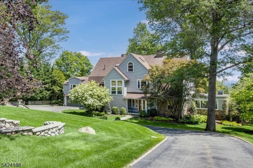 Set gracefully back from the road, this exquisitely renovated custom Colonial situated on park-like grounds is the definition of refined Montclair living. Redesigned to blend timeless character w/ modern luxury, this home exudes understated sophistication. The expansive eat-in kitchen features radiant heated flrs, marble island, farm sink, high-end appliances, granite countertops & custom cabinetry w/ abundant storage. Just off the kitchen sits a convenient den/playroom & formal dining room. Additional 1st fl highlights include a gracious living room w/ fireplace, bright family room, spacious mudroom, stylish powder room, large foyer & private office. Upstairs, the luxe primary suite is a showstopper, featuring two walk-in custom closets, a dressing room & a spa-like bath with soaking tub, double vanity & radiant heated floor. Two additional bedrooms, a full bath, and a convenient laundry room complete the 2nd fl. The 3rd fl offers two more bedrooms, a spacious full bath & ample storage. A private sixth bedroom w/ ensuite bath above the garage makes the perfect guest or in-law suite. Unfinished, water-proofed basement offers added potential. Outside, a secluded pool w/ travertine surround, pool house w/ powder room & kitchenette & beautiful gardens create a resort-style experience. Additional features include electric car charger, irrigation, exterior drainage, window seats, many new windows. This one-of-a-kind home is a rare opportunity to live in style & comfort.