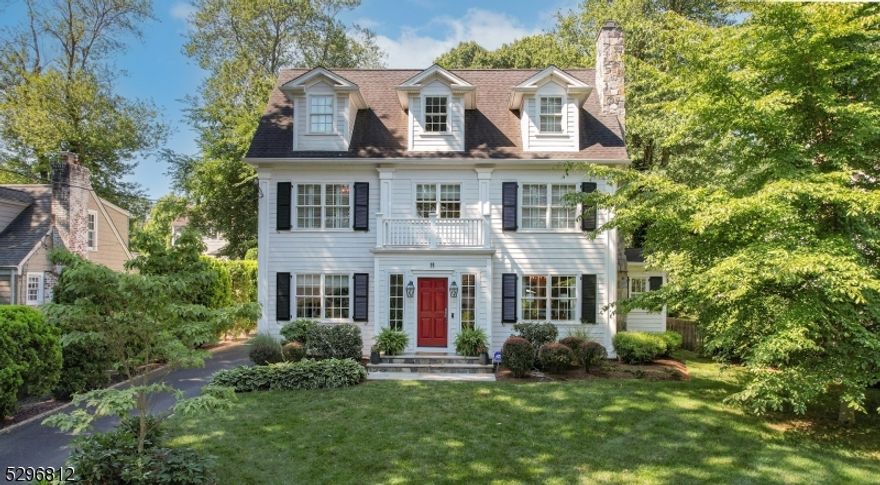 Better than brand-new, this truly custom home is a testament to impeccable design, thoughtful functionality & high-end finishes. From the moment you enter the stately foyer, you are greeted by sophistication and style. It's all in the details with transom windows, designer light fixtures & pocket doors galore!. The chefs kitchen features Viking appliances & huge marble island with functional butcher block. The gorgeous Vermont honed slate countertops continue into an enviable butlers pantry that serves as a coffee/work station for today's busy needs. A sunlit half bath is situated nearby. The kitchen flows into a generous family room anchored by a cozy stone gas fireplace with custom paneling. Wet bar featuring sink, wine refrigerator and double refrigerator drawers make entertaining both easy & fun. Light abounds with oversized windows & multiple sets of French doors leading to the backyard sanctuary.  A charming side entrance porch leads to mudroom with slate flooring & custom cabinetry. Oversized dining room with fireplace & an office/sitting room with generous windows/light complete the first floor. Second floor offers two story primary suite with luxurious marble bath, walk in closet & gas fireplace. Two additional bedrooms offer tray ceilings & custom closets & double vanity hall bath features one of TWO laundry areas.  Gorgeous open staircase leads to relaxing 3rd floor sitting area, huge bedroom with two walk-in closets & spa like marble bath.