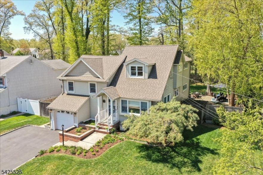 Amazing Location - Expanded custom split home offers 5 levels of living space designed for flexibility and everyday comfort! With 3 thoughtful additions, it features 4 bedrooms and 2.5 updated baths. The primary suite features high ceiling, large bath, double closets and a laundry room. The massive kitchen opens directly to the backyard entertaining area through double French doors, creating seamless indoor-outdoor flow. Expansive family room features a newer pellet stove fireplace with a hidden speakeasy-style bar on the ground level - a truly unique feature for entertaining. The finished basement adds even more versatile space. BRAND NEW ROOF and ALL NEWER SYSTEMS! Multi-zone HVAC (2-unit system) for efficient comfort throughout. Pristine and move-in ready! Level lot of approximately .26 acres boasts an incredible outdoor setting. The backyard is a true retreat with a paver patio, koi pond, raised garden beds, and a charming storage shed complete with a front porch & window boxes perfect spot for relaxing. Conveniently located near top-rated schools, local parks, and just moments to downtown Cranford for shops, dining, and NYC transportation. This home is not located in the flood zone.