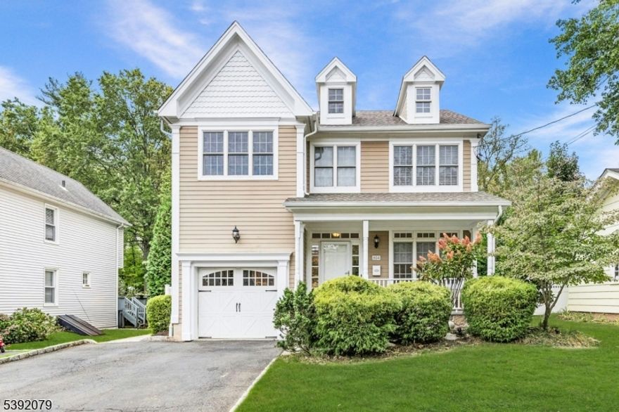 Located on one of Westfield's most desirable streets, this 5 Bedroom, 4.5 Bath Colonial offers nearly 6,000 sq. ft. of luxury living space on a .25acre lot that backs to the bird preserve, just blocks to schools, downtown, and the train station. Exceptional craftsmanship throughout with elegant millwork, hardwood floors, designer lighting, and thoughtful storage. The grand foyer opens to a sunlit living room, formal dining room, and a spacious family room with gas fireplace. The chef's kitchen boasts high-end appliances, a large island, custom white cabinetry, walk-in pantry, and breakfast area. A first-floor in-law suite includes a marble bath, walk-in closet, and laundry. Upstairs, the primary suite is a private retreat with sitting room, double-sided fireplace, spa-like bath, balcony with French doors, and walk-in closet. Three additional bedrooms, a full bath, and laundry complete this level. The finished basement features a rec room, full bath, gym, office, and storage. Outside, enjoy a Trex deck, paver patio with fireplace, and expansive vinyl fenced yard perfect for entertaining. Additional highlights include surround sound systems, central vacuum, sprinkler system, alarm system, Hardie siding, and multi-zone HVAC. Walk-up attic can easily be turned into livable space. A truly stunning home in the perfect Westfield location!