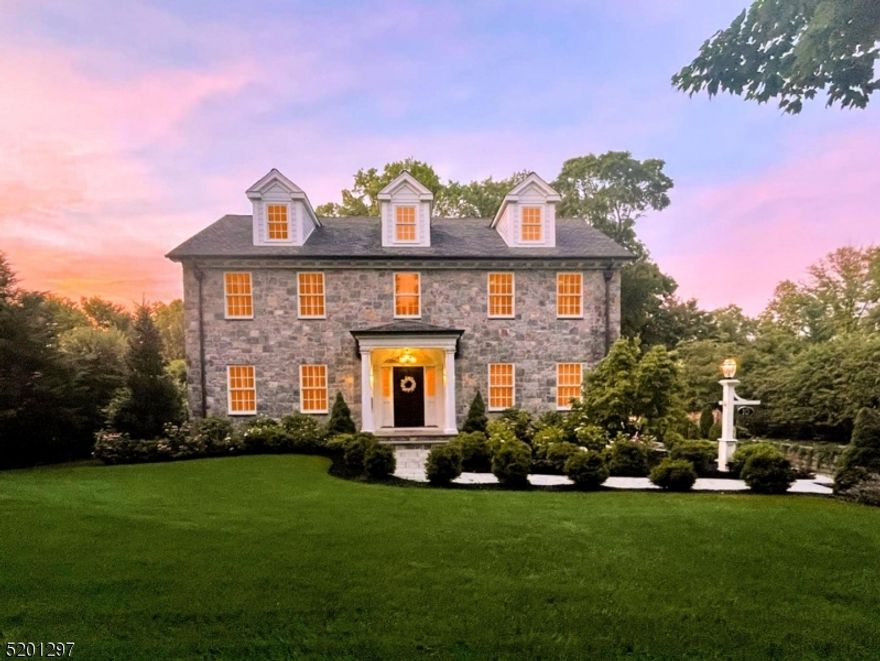 GET READY TO HAVE FUN! Nestled in Madison's premier HILL neighborhood, this 7 bdrm. 5.1 bth CUSTOM Colonial is elegantly finished over 4 floors w detailed craftsmanship featuring hardwood floors, 5 fireplaces, custom cabinetry, raised-panel moldings, coffered ceilings & custom plantation shutters throughout. The welcoming foyer flows into the formal dining room w large windows, paneled moldings & flow into the kitchen. The stunning kitchen is the heart of the home w coffered ceiling; lounge w marble gas fireplace; high-end gourmet appliances; lrg quartzite island; banquette seating; bar w 2 bev fridges; and gorgeous windows. The family room is the gathering spot with gas FP/paneled mantle and French doors to sunroom with stone FP with wall of windows/French doors to deck. Primary suite is an oasis with gas fireplace, 2 walk in closets and spa-like bath with extra-large shower, tub and double vanity. Second floor has 3 additional large bdrms with custom closets, 2 full baths and laundry room. 3rd fl has 2 additional bedrooms/office with full bath and storage room.Finished lower level features a bedroom/gym, large rec room w gas fireplace and large mudroom with built in cubbies and entrance to oversized 3-car garage.  The resort-like backyard is ready for summer w heated, saline, gunite pool; 7-person hot tub; 2 levels of Trex decking, lush yard & mature landscaping. WALK TO NYC TRAIN, TOP-NOTCH SCHOOLS & TOWN. NJ MONTHLY VOTED MADISON #1 TOWN TO LIVE!