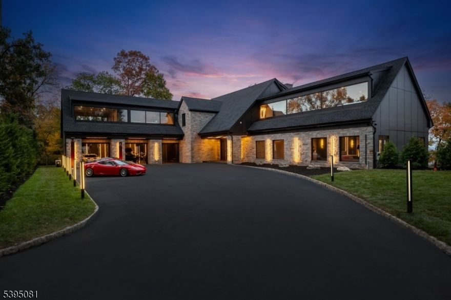 Modern. Seductive. Unapologetically bold. Welcome to "The Allure" a striking architectural masterpiece by ECS Homes redefining modern luxury in Totowa's hilltop. This entertainer?s paradise fuses high design and sensual minimalism with soaring spaces, smoked glass railings, black marble staircases, radiant heated flooring, and custom LED lighting throughout. The dramatic great room opens to a massive balcony with panoramic city views, while the designer kitchen with full prep kitchen and main-level primary suite with sculptural tub and smoked-glass shower epitomize indulgence. Upstairs offers a loft with coffee bar and three ensuite bedrooms, including a spa-style alternative primary. The lower level features a gym with infrared sauna and cold plunge, wet bar, and recreation area opening to the resort-style pool and terraces. Finished with radiant floors, epoxy garage for six, generator, and elite imported finishes. The Allure defines modern desire.