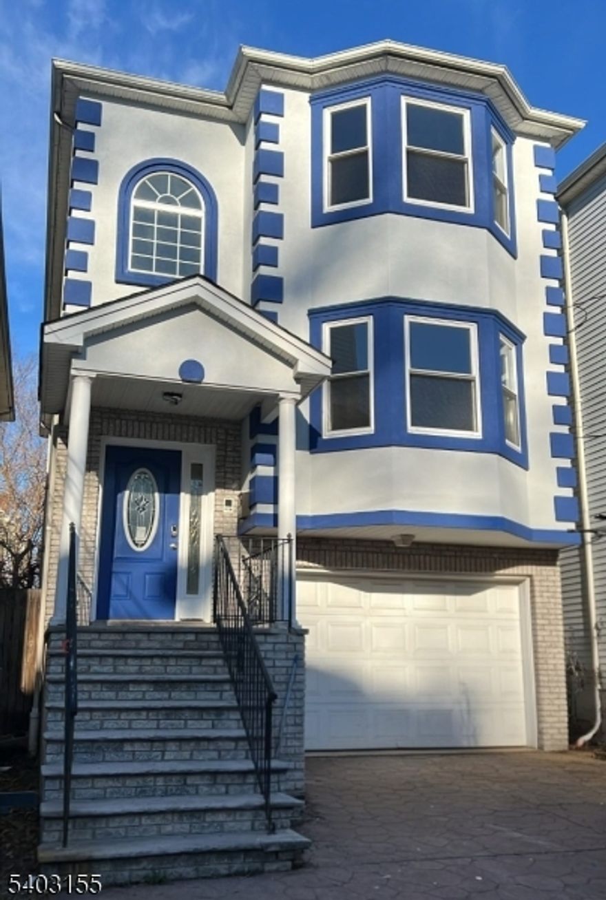 Exceptional newly renovated 2-family home offering space, flexibility, and long-term value in Elizabeth. This oversized 3-story property features two spacious apartments, each with 3 bedrooms and 2 full bathrooms, thoughtfully designed with modern layouts and quality finishes throughout.Both units showcase designer kitchens with modern cabinetry, elegant gold hardware accents, brand-new stainless steel appliances, and beautifully finished hardwood floors. Each apartment has its own dedicated HVAC system, providing efficient and independent heating and cooling.The ground level includes a finished space with two additional rooms and a full bathroom, offering versatile functionality for home office use, recreation, or general-purpose space (buyer to verify permitted use).Additional highlights include a brand-new roof, built-in garage, ample off-street parking, separate utilities, and low-maintenance vinyl siding. Conveniently located near major transportation routes, shopping, and local amenities. A strong opportunity for a turnkey multi-family property with modern systems and flexible space. Schedule your private showing today.