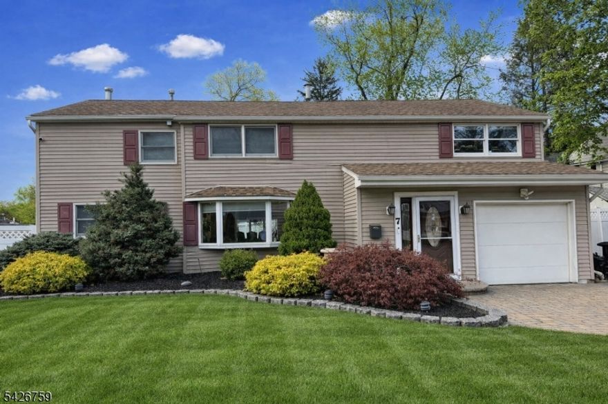 Waldwick's best-kept secret has officially hit the market. This beautifully renovated 3,200 sq ft home offers the rare combination of space, warmth, and modern open-concept living. The stunning high-end kitchen anchors the main level with a generous breakfast area and bar, flowing seamlessly into the open dining and living spaces allows natural light to flow through the home and create an effortless environment for both everyday living and entertaining. A cozy family room with a gas fireplace sits just beyond, with sliders leading to a fully fenced backyard and a large patio perfect for summer gatherings. Convenience shines with first-floor laundry, a powder room, and a mudroom designed to keep daily life organized. Upstairs, the primary suite is a true retreat, featuring two oversized walk-in closets and a spa-inspired bath complete with a jetted tub for two and a rain shower. Three additional bedrooms each offer spacious walk-in closets and share a beautifully updated main bath. The finished basement adds two versatile bonus rooms ideal for work, play, fitness, or media. Outside, the home offers a one-car garage plus driveway parking for up to five vehicles. Set on a generous lot in one of Bergen County's most beloved towns, this home checks every box for comfort, style, and modern living. Professional photos coming soon   this one won't last !!