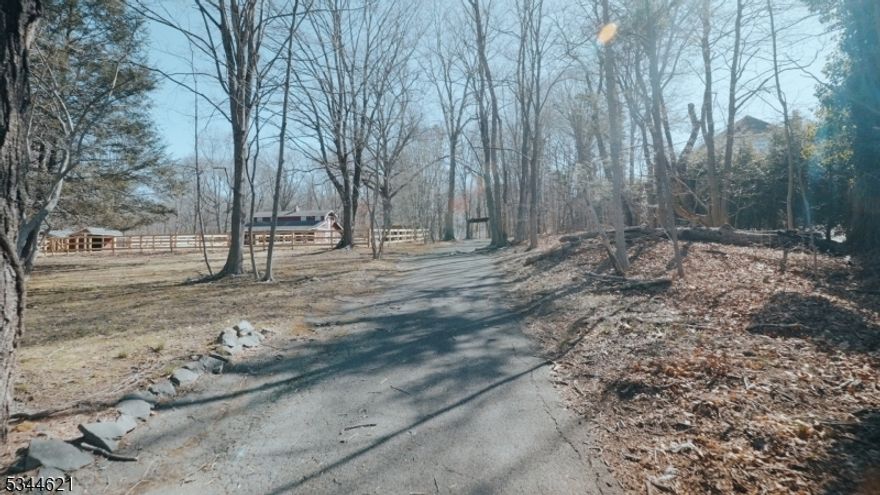 Discover the possibilities of this picturesque 3-acre property, perfectly positioned in the highly sought-after town of Saddle River.  Offering a serene and private setting, this unique property presents an exceptional opportunity to create a custom luxury estate or embrace its equestrian potential. Equipped with a well-maintained barn and newly fenced acreage, this property is ideal for those who appreciate the charm of country living while being just moments from dining, shopping, and top-rated schools. Whether you envision building your dream home or using it as an equestrian retreat, this expansive lot provides the perfect canvas. The existing colonial farmhouse is being sold as-is, as the seller will not be obtaining a CCO.