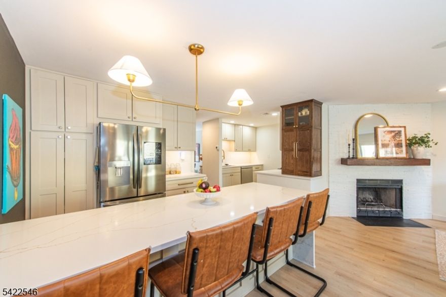 Welcome to Franklin Corners, an ideal townhouse community located in the heart of Morristown. Unit 7E is an elegantly appointed home with an open concept living, dining and kitchen space with tons of natural light. A fireplace, full bath and access to the garage complete the first floor. The second floor features a full bath, laundry and two bedrooms - one with a large walk-in storage area and the other with large closets and a deck.  The third floor is your sanctuary bedroom - complete with a wet bar, fantastic closet and full bath with a walk in shower and tub. A finished basement can be used as your gym, office, den or all three. Your living space extends to the outdoors with two decks. Nothing to do except unpack!