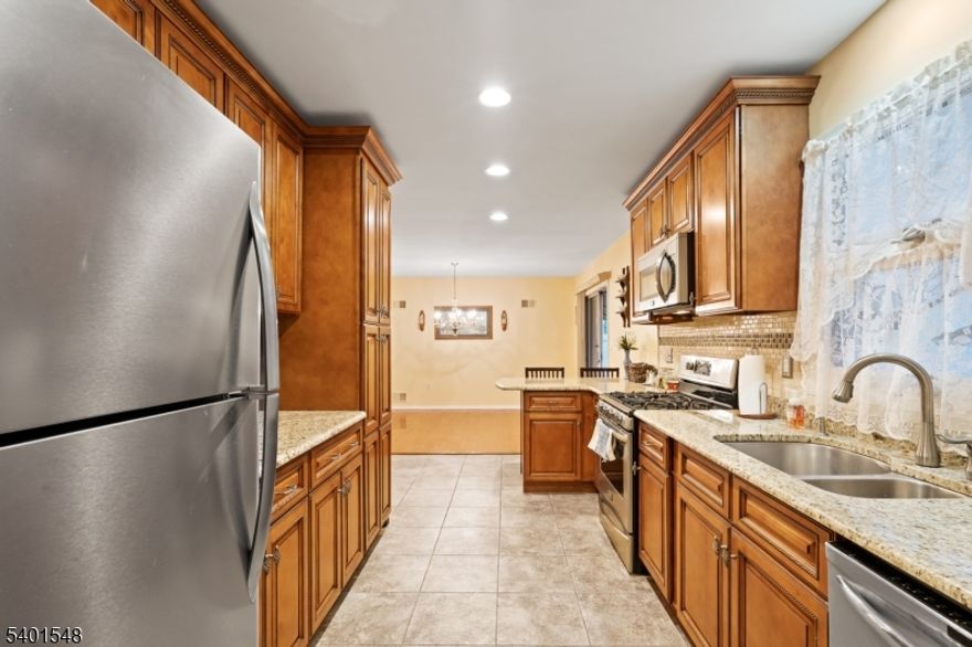 Welcome to this beautifully cared for home offering a perfect blend of comfort, functionality and style. This ranch style home features a living room, updated kitchen with stainless steel appliances, granite countertops and breakfast bar, dining room, two generous size bedrooms with ample closet space and new carpet, laundry/utility room. A new central air unit has just been installed. The added convenience includes a garage with inside access. Outside, you will find a private backyard with a covered patio for gatherings and enjoyment.Close to major highways and shopping.