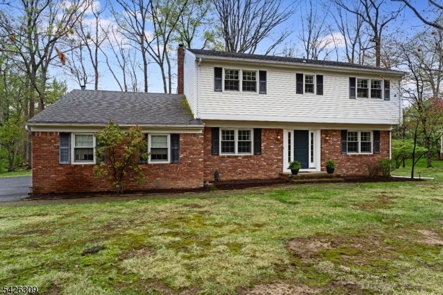 Traditional center hall colonial home on a lovely tree-lined cul-de-sac street in a location offering easy access to the town community center, pool, and fields as well as the NJ Transit train station.  Eat-in kitchen with granite counters, center island, and stainless appliances steps down to a cozy family room with fireplace and French doors leading to the yard.  Formal living and dining rooms with hardwood floors, laundry and powder room complete the first level.  Private primary bathroom with shower and wood floors throughout all remaining three bedrooms.   Lower level is waiting to be finished!  Two-car garage, natural gas baseboard hot water heat, and central air.  Public water and sewer..