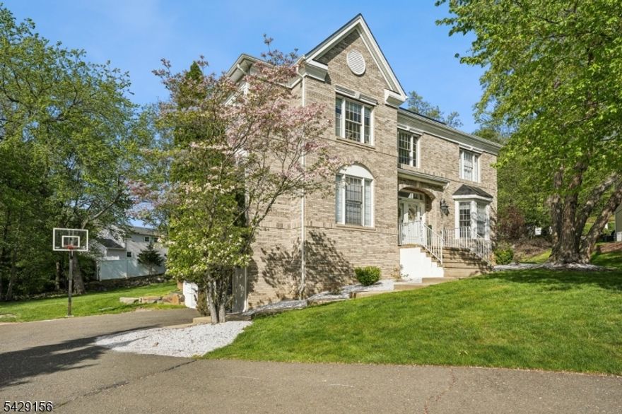Welcome to this stunning brick-front Colonial, perfectly positioned on a private cul-de-sac in one of Wayne's most sought-after locations. Thoughtfully and fully renovated, this home delivers a seamless blend of modern design, high-end finishes, and functional living. The interior showcases a brand-new kitchen designed to impress, featuring sleek cabinetry, stylish finishes, and updated appliances ideal for both everyday living and elevated entertaining. All bathrooms have been completely renovated with a clean, sophisticated aesthetic. The home's spacious layout is complemented by a fully finished basement, offering versatile additional living space perfect for a media room, home office, gym, or guest setup. Recent major upgrades provide added value and peace of mind, including a newer roof (approx. 6 years old) and a central air system just 3 years young. Complete with a two-car garage and set in a prime location close to schools, shopping, dining, highways, and public transportation, this move-in ready home checks every box for today's buyer.