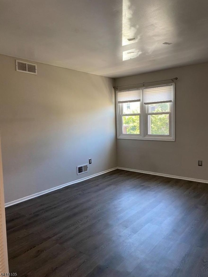 Excellent Townhome for Owner/Investor. Currently Rented for $2,350/month. Offers 2 Large Bedrooms; full bath plus powder room. Private Laundry in basement.  Updated Kitchen with granite counters. Oversized family room features Fireplace, with sliders to Deck. Rear deck and privacy fence perfect for alfresco dining. Recently replaced roof and furnace. Assigned parking space. Great Location! Convenient to shopping, hospitals, sports, restaurants, State Theater, parks, highways and public transportation - train and bus. Easy access to Rutgers University, RWJ Univ hospital, St Peters Univ Hospital, Rt 18, 27, 1, 287, and 95/NJ Turnpike.