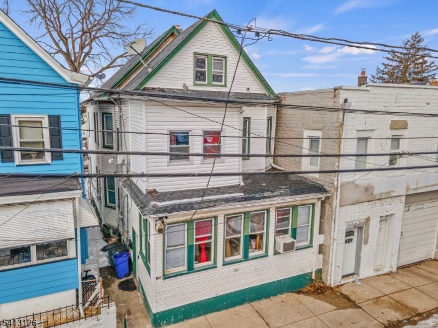 Welcome to this well-maintained two-home property in Passaic, offering space, versatility, and an unbeatable location. Featuring a total of 6 bedrooms and 2 full bathrooms, this property is ideal for Owner-occupants or savvy investors.The first-floor unit offers three generously sized bedrooms, a comfortable living room, a dedicated dining area, and a functional kitchen?perfect for everyday living and entertaining. The second-floor unit features three bedrooms, a bright living room, and a kitchen, providing excellent rental potential.A partially finished basement adds valuable bonus space for storage, recreation, or future possibilities. Conveniently located near schools, parks, shopping, and public transportation, this home delivers both accessibility and long-term value.A fantastic opportunity to own a multi-unit property in a high-demand area?don?t miss it!