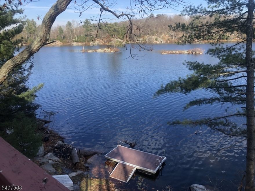 2 Lakefront buildings with dock, situated on serene Panther Lake. One home offers 2 full Baths, 2 Bedrooms, with 2 offices along with a 2 car garage below. Cedar shake siding with Hardwood floors throughout exploit the Lake feel. This home provides ample space for those looking to generate rental income, or for living, or both. The exterior decks and area offer plenty of room for relaxation and entertaining. The second building is a quaint 1 bedroom cottage, with full bath.( I have just recently AirB&B it)The full glass windows in the cottage, offer panoramic views of the peaceful lake and its wildlife. Situated on a spacious 1.17-acre lot, there is plenty of outdoor space to enjoy the tranquility of nature. Whether you're looking for a primary residence or an investment property or both, 6 Jans Way has the potential to fulfill your needs. Located 50 miles from Manhattan, 35 minutes from Mountain Creek and Camelback Ski Areas, and close to shopping, Great restaurants and Entertainment It is the perfect place to be away and yet close to what you need.