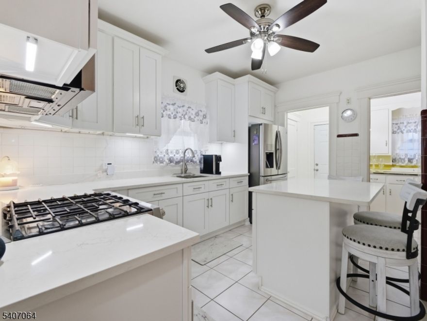 Welcome to this beautifully maintained single-family Colonial nestled near the desirable East Park area of Paterson. This elegant residence offers 3 spacious bedrooms, 2.5 baths, a finished basement, and an unfinished stand-up attic presenting exceptional potential for future customization. The renovated kitchen is enhanced with newer appliances and flows seamlessly into a thoughtfully designed layout ideal for both everyday living and entertaining. Additional highlights include a one-car garage with an extra parking space, a private, nicely sized backyard, and a sun-filled four-season porch perfect for year-round enjoyment. A rare opportunity to own a meticulously cared-for home in a peaceful yet highly convenient location. Property is being sold strictly as-is.*Take advantage of a $18,000 seller concession toward closing costs, helping to significantly lower your upfront expenses and make homeownership more attainable.*