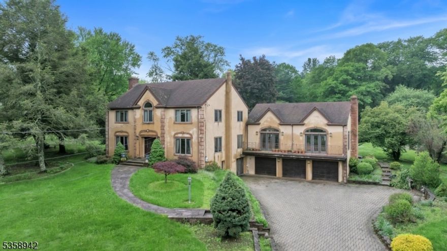 Colonial Style single family home with Scenic Views & Expansive Living Space. Experience timeless elegance and modern comfort in this impressive Colonial-style estate, offering over 6,600 sq ft of finished living space on a 1.848-acre lot in a serene, scenic setting overlooking the Haledon Reservoir and Franklin Lakes Nature Preserve. Features 4,614 sq ft main home + 2,010 sq ft finished walk-out basement, 13 rooms total, including 6 spacious bedrooms and 4 full bathrooms, Hardwood and tile floors throughout, Summer kitchen, Accessory Unit, 1,251 sq ft separate structure   perfect for a guest suite, home office, studio, garage. Expansive 2,258 sq ft deck, Two driveways for added privacy and access, 3-car attached garage, 1 detached garage ,totaling 4 garages. Enjoy tranquil surroundings with unmatched access to outdoor recreation, all while being just minutes from major highways, top-rated schools, dining and shopping.This one-of-a-kind property blends luxury, flexibility, and privacy   a true gem in an exceptional location.