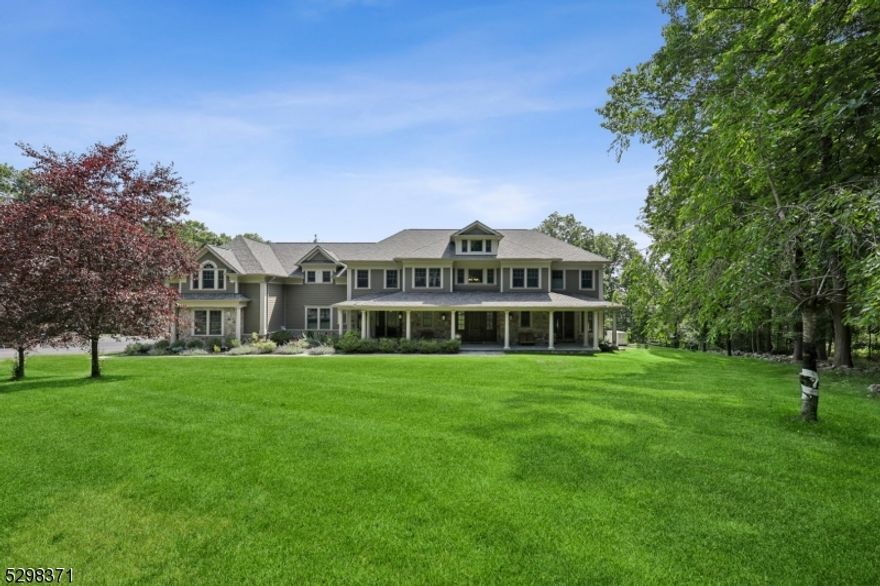 An impressive home by any measure, this exceptional CUSTOM home spanning 7,300 square feet is certain to turn heads. Built in 2016 and situated on over 5 acres of serene property, this residence is a testament to refined elegance and exceptional craftsmanship with beautiful hardwood floors, high ceilings, three fireplaces, and gorgeous millwork throughout. As you step inside, you are greeted by the two-story foyer, flanked on either side by a formal living room and a stunning dining room. Featuring a gourmet eat-in kitchen with high-end Wolf/SubZero/Bosch stainless steel appliances, large center island with seating for four, an additional breakfast area, soft-close wood cabinetry, Butler's pantry with a wine refrigerator, a dry bay and two additional pantries. The EIK with a French door to the composite deck flows into the family room. Truly a wonderful home to entertain loved ones inside and out. This level also includes an office/study, convenient 1st floor bedroom suite with a full bath, mud room and two powder rooms. The luxurious primary suite includes two massive WIC's, dressing room, sitting room with a balcony overlooking the tranquil setting and a spa-like bath with dual vanities, soaking tub and a stall shower. All bedrooms are extremely spacious & features WIC's. This home also includes multi-zone HVAC, 4-car garage, whole house generator, new well in 2020, HardiePlank exterior & much more! Close to top-rated schools, parks, downtown Bernardsville & NYC train.