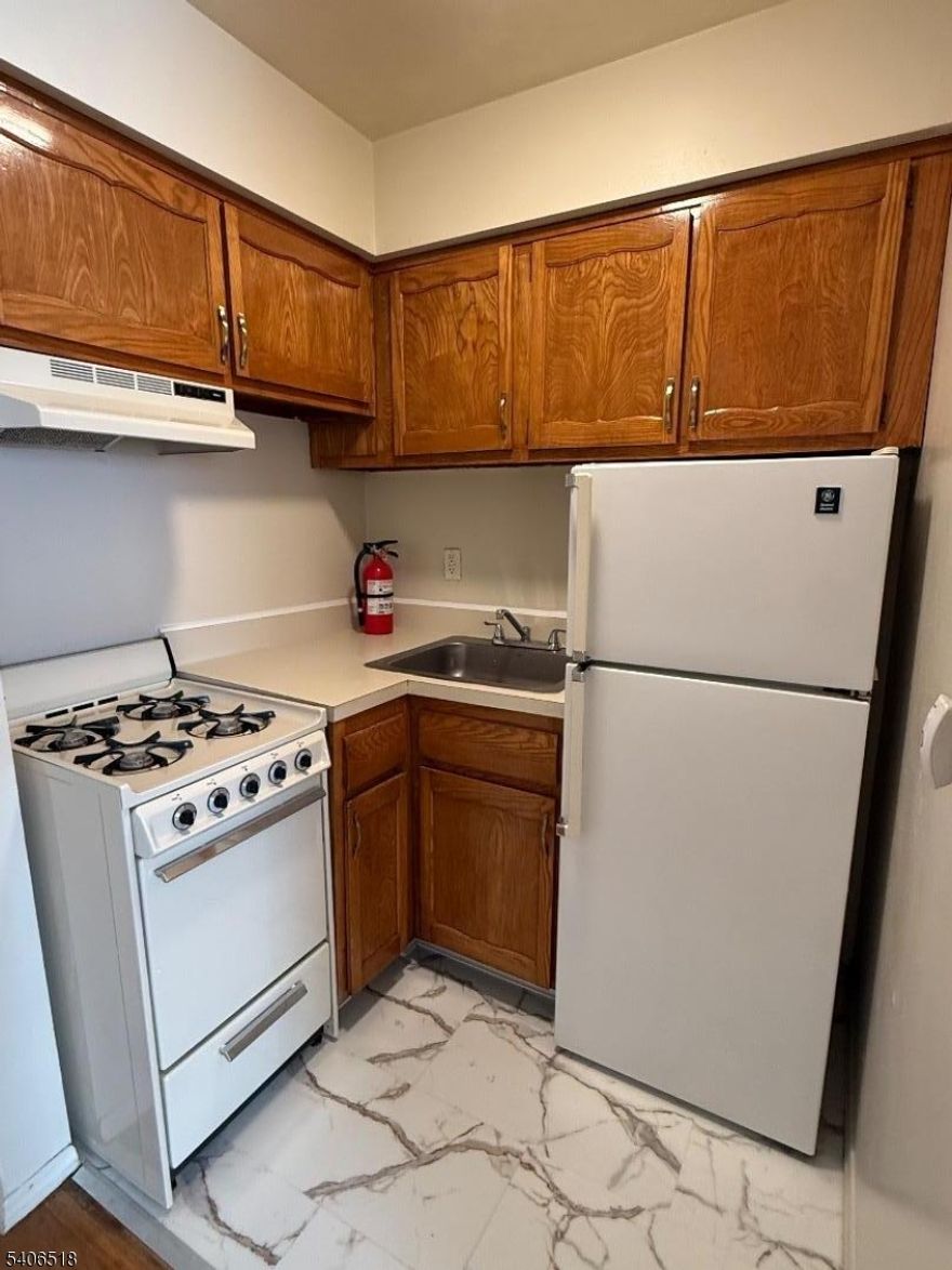 Very nice studio apartment in a park-like setting with freshly refinished hardwood floors throughout and a fresh coat of paint. Features a galley kitchen with refrigerator, wall AC unit, hot water included, laundry room, parking available, and convenient access to transportation. Garage is additional if available!
