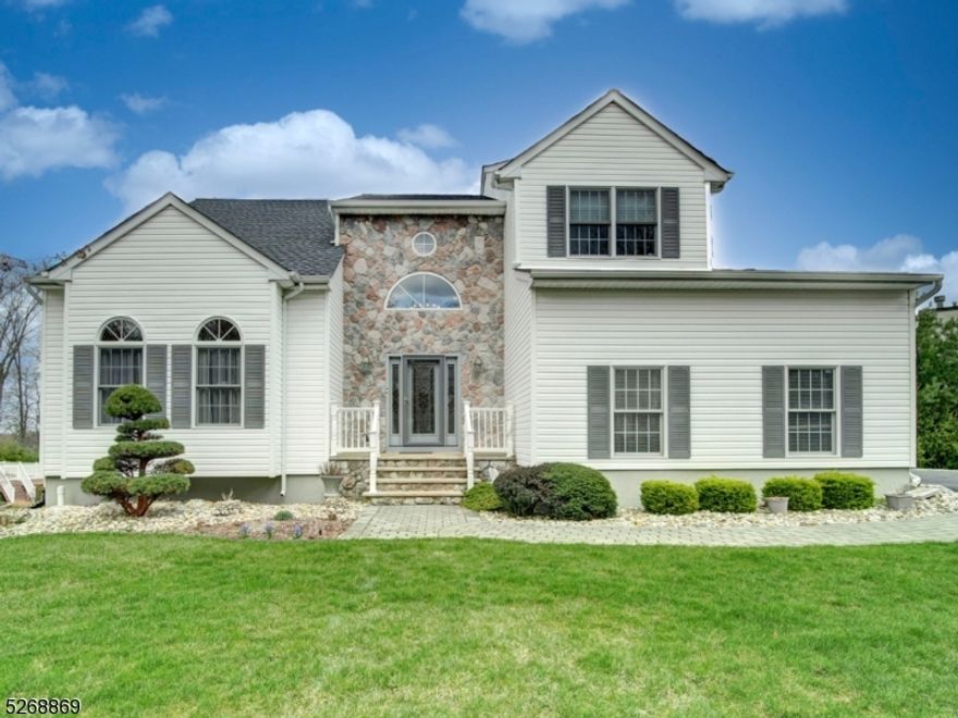 Immaculate, Well maintained & Move in Ready! Available for quick close. NEW ROOF (Oct 2022) NEW AIR CONDITIONER (2022) Two-story foyer entry, spacious formal living & dining rooms, both offering crown moldings and recessed lighting. Kitchen has newer stainless steel appliances, granite counters, an included matching granite custom table and chairs, and has sliders that leads to the huge Trex deck which is the length of the house.The family room features marble surround gas fireplace. Large laundry room and power room complete the first floor. The second level has new flooring (installed 2023) The large primary bedroom plus en suite includes a huge walk-in closet and full bathroom with stall shower, double vanity and soaking tub.There are 3 additional bedrooms, plus a main bath on the second floor. The full-finished walkout basement is a big plus here for added living space....it features recreation room, summer kitchen, full bath with shower stall, storage room and sliders to patio/tree lined backyard. Public utilities here! A commuters dream--minutes from routes 46, 10, 80. A must see!