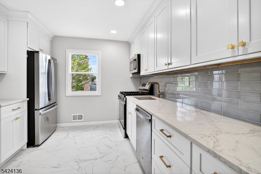 Welcome to this beautifully updated 3 bedroom, 1.5 bath home located in highly sought-after Fanwood. This move-in ready property features gleaming hardwood floors throughout the first level, a fully renovated modern kitchen with stylish finishes, and tastefully updated bathrooms that truly shine. The lower level offers a flexible space that can be used as a family room, rec room, or whatever you wish! This space has modern laminate floors and a half bath for convenience. The backyard is perfect for entertaining with a covered patio and plenty of grass to enjoy. The spacious layout offers comfort and versatility, perfect for today's lifestyle. Ideally situated just a stone's throw from the train and downtown area, this home offers exceptional convenience for commuters. Enjoy close proximity to local parks, as well as easy access to major highways and nearby bus routes. Located in a top-rated Blue Ribbon school district, this property combines location, lifestyle, and quality living in one outstanding opportunity. Don't miss your chance to be in a great spot in Fanwood! Fanwood has a A+ rating by Niche, who ranked it the #1 town to live in Union County and #3 in New Jersey!