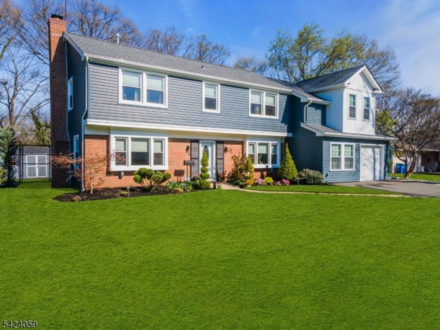 STUNNING fully renovated Colonial with 5 Bedrooms,3 full baths, + office/rec room. If curb appeal is your vibe, look no further! Custom crafted to enjoy modern updates in a desirable neighborhood. Fully updated kitchen with Quartz counters, breakfast bar, newer SS appliances, skylights, and adjoining oversized pantry.. Formal dining room being used as added living space leading to a 1st floor spacious bedroom. Brand-new full bath on the 1st level as you enter. Large family room with woodburning FP. Downstairs you will also find a laundry-utility room. Laminate and engineered hardwood throughout. Upstairs you will find the Primary Bedroom w/ tons of natural light, recessed lighting, and a fully upgraded Ensuite bath w/ double sinks, marble counters, linen closet.  You will also find 3 more bedrooms including a huge bedroom designed to give you ability to convert to addtl ensuite if you wish. Plus flex office-exercise room, and 2 linen closets.  Major updates include new custom addition, siding, timberline roof, gutters, (1) Lenox HVAC,new ductwork for 2nd floor in 2024. 2-zone HVAC. All windows and doors have been replaced. Serene backyard with over $75k+ in upgrades. Fully fenced with paver patio along with hot tub and shed. Prime location for commuters. Less than 10 min to Rutgers University, 2 major hospitals, beautiful parks and golf courses. Easy access to Rt 287/NJ Tpk/Rt 1. Rare opportunity to own a home where design and living space come together seamlessly!