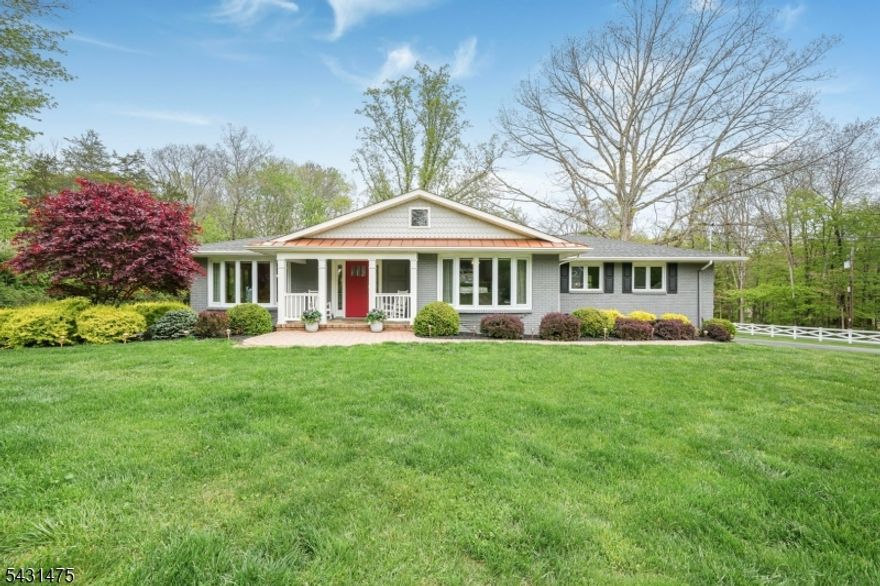 Beautifully renovated home offering the ease of one-floor living, thoughtfully updated interiors, and a private, park-like setting just minutes from charming downtown Chester. Combining comfort, functionality, and modern upgrades, this home delivers a move-in ready lifestyle. The updated kitchen features abundant white cabinetry, stainless steel appliances, granite countertops, and a peninsula-style layout that opens to a bright breakfast area with sliding doors to the patio. Separate living and dining rooms create comfortable, well-defined spaces, enhanced by remote-control blinds. Spacious bedrooms and beautifully renovated baths enhance the home's turnkey appeal. The finished lower level with private entrance offers exceptional flexibility for recreation, media, guests, or work-from-home needs, with Bilco doors providing secondary egress. Outdoor living is equally inviting, with a large paver patio overlooking a level yard framed by mature trees. An additional outbuilding provides storage. Additional highlights include hardwood floors, whole house generator, tankless hot water heater (6 months), new furnace (2024), a remote-control blind in the primary bedroom, and a septic system replaced in 2016/2017 and meticulously maintained.Located within a highly regarded school district, including West Morris Mendham High School with its IB program. A rare opportunity to enjoy turnkey living in one of Chester's most desirable settings. Please note that this home has a 3 bed septic