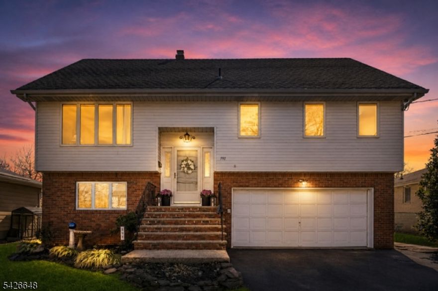 Welcome to this stunning custom bi-level home, situated in the highly sought-after Richfield section. Offering exceptional space, versatility, & comfort, this meticulously maintained property is move-in ready. Enjoy the convenience of being close to everything as sidewalks lead to schools, parks, and shopping - while benefiting from a quiet residential setting. From the moment you arrive, you'll appreciate the oversized two-car garage, abundant off-street parking, & the tremendous amount of storage space this home provides. Andersen windows throughout, central air, & quality craftsmanship elevate both comfort & style. The residence features 6 generous bedrooms & 4 full bathrooms. The primary suite includes two closets & its own private bath. The first floor showcases a bright & spacious living room, a formal dining room, & a large eat-in kitchen that opens directly to the deck, perfect for entertaining or relaxing above the beautifully fenced-in backyard. The ground-level offers a full bedroom and bath, and a layout ideal for guests. Additional upgrades include a brand-new washer and dryer, newer central air, & three zones of efficient baseboard heat. This exceptional home combines size, flexibility, and premium features in one of Clifton's most desirable neighborhoods.