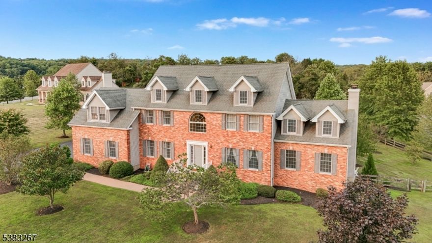 Welcome home! Beautifully Maintained Hemingway estate home. Approx 3,610 sqft of living space featuring a full brick front, designer kitchen with custom cabinetry, granite countertops, tile backsplash, center island with 6-burner cooktop, double oven, stainless steel appliances, and large pantry. Sliders lead to a 70'' maintenance-free deck overlooking a private backyard oasis with an in-ground fiberglass pool, stamped concrete patio, and professional landscaping. Inside, enjoy hardwood flooring throughout the 1st and 2nd floors, a formal living and dining room, and a 1st-floor den/guest room with French doors. The 2-story great room boasts a floor-to-ceiling stone fireplace. The luxurious master suite offers a tray ceiling and spa-like bath with Jacuzzi. A huge 2nd-floor suite/playroom with full bath plus two additional spacious bedrooms complete the upper level. The partially finished basement (over 800 sq. ft.) includes a combo pool room, game room, and leisure room, with walkout access to the pool area and ample storage. Whole home generator for peace of mind.