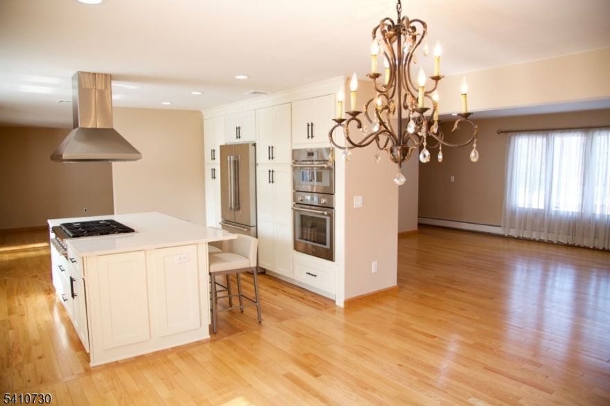 Spectacular, Updated Colonial, set on a quiet cul-de-sac,in one of East Hanover's most desirable neighborhoods. Thoughtfully updated throughout with timeless elegance and modern sophistication. This home offers a stunning kitchen with quartz countertops, stainless steel top-of-the-line Thermador appliances -seamlessly flowing into the living and dining areas -perfect for upscale entertaining. Adding to the elegance of this home is the inviting family room with gas fireplace and sun-drenched all season room overlooking the beautifully landscaped, fenced in yard. The expansive Trex deck creates an ideal outdoor retreat. The second level displays the luxurious primary suite featuring a spa inspired bath and walk in closet- three additional bedrooms- one with a private balcony, and a sleek updated bath complete the 2nd level. The beautifully finished lower level elevates the home's versatility, offering a sophisticated recreation space, private office, and full bath-ideal for guests, work-from home, extra living or leisure space.. A rare opportunity to own a move-in-ready fully updated home that embodies comfort, design, and distinction. East Hanover offers easy access to major highways, NYC trans, shopping, restaurants, parks, top-rated schools, and low taxes. This beautiful home awaits its proud new owners. Video in media section