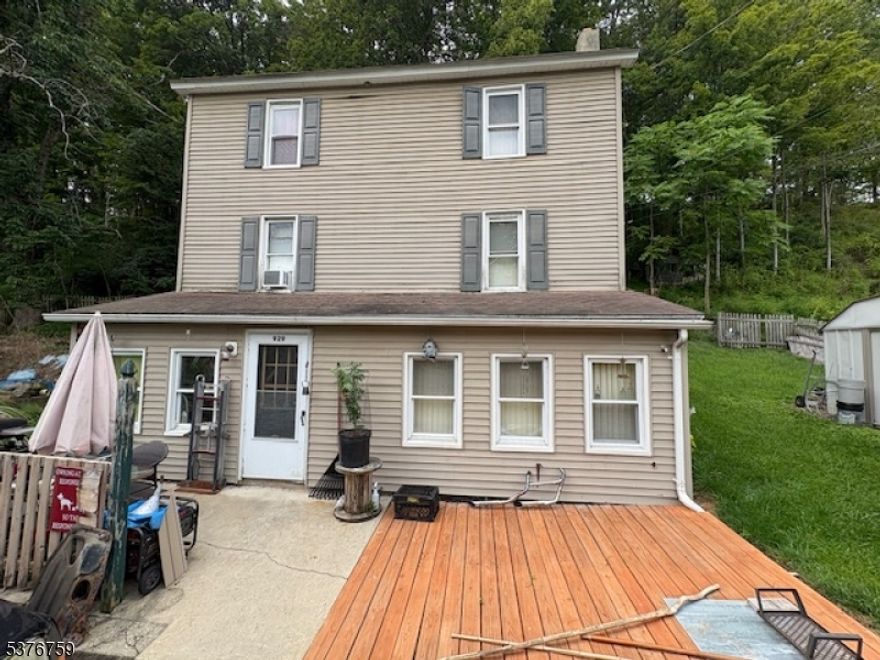 Welcome to this spacious 3-bedroom, 1-bath colonial tucked away in a peaceful, private setting. Featuring a first-floor mudroom, large eat-in kitchen, and open living room with wood stove and charming brick accent. Upstairs offers a full bath, primary bedroom, and family room.The third level includes two bedrooms with walkout access to a large deck. Schedule a tour today-