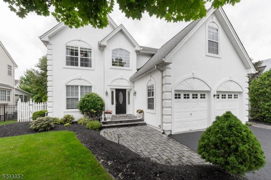 Meticulously maintained, east-facing colonial w/ original owners, spanning 3 levels of living in prime Bridgewater neighborhood served by highly-rated Milltown School. Step inside & the two-story foyer w/ hardwood flooring & custom molding set the tone for the tasteful & stylish design throughout. The sun-drenched living room seamlessly opens into the dining room, an ideal layout for entertaining. The updated kitchen is equipped w/ ss appliances, white cabinets, granite counters, tile backsplash & striking matte black light fixtures & accents. The breakfast nook has lots of natural sunlight, great for casual meals or morning coffee. Continuing w/ the open floor plan, the adjacent family room opens to the private backyard & features a wood fireplace, perfect for game nights. An updated powder room & laundry room w/ the 2-car garage access  complete this floor. Upstairs, the expansive primary suite features 3 large closets, incl. a walk-in as well as a sitting room/office w/ custom cherry built-ins; a great space for working or relaxing w/ a good book. The ensuite has separate vanities, a garden tub & shower stall. Completing the 2nd fl are 3 generously sized bedrooms w/ ample closet space & a beautifully renovated bathroom. The finished bsmt adds approx. 1,000 sq ft of living space w/ a rec/media room, gym, bonus room & storage galore. Don't miss the resort-style backyard w/ multi-tier paver patios and in-ground heated pool & spa. It is the ultimate spot for outdoor living.