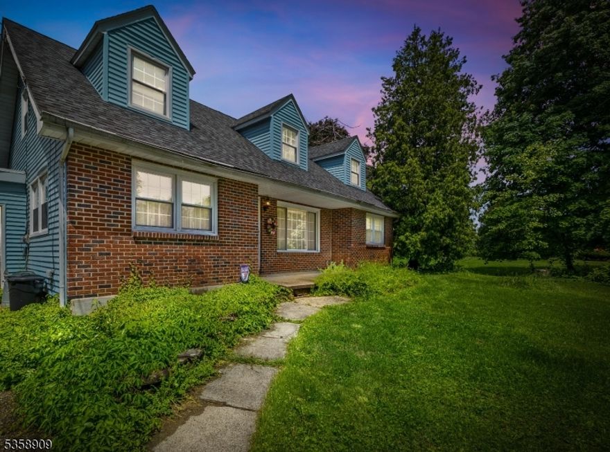 Welcome to this beautifully crafted home, nestled on a picturesque 1-acre lot with serene mountain views and easy access to Route 78 (Exit 7). This lovely home is located in Greenwich Township This property offers a perfect blend of fine craftsmanship, thoughtful updates, and flexible living spaces ideal for today's lifestyle. Step inside to find gleaming hardwood floors, gorgeous custom trim work, and a bright front-to-back living room featuring a brick hearth with an inviting pellet stove. The skylight above the center-island kitchen flows nicely into the dining area, with custom woodwork and abundant natural light perfect for entertaining or everyday living.The first floor offers a versatile layout with a bedroom and a separate office/study, while the second floor includes three additional bedrooms with charming dormer windows and rich wood flooring. The full basement includes a dedicated storage and laundry space and additional framed areas ready for your personal touch. The unfinished portion is a blank canvas ideal for a home gym, media room, or workshop.Outside, enjoy a usable, level yard with an inground pool, garden area, and plenty of space to create your own private oasis. With a little love and care, the backyard can become your perfect escape from the hustle and bustle of everyday life.Don't miss this opportunity to own a home full of character, comfort, and potential! Home being Sold AS IS, including Fireplace and Pool As Is