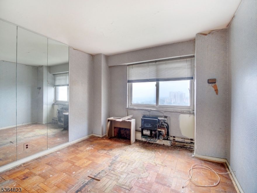 Attention all OWNER OCCUPANT visionaries with CASH and frugality! (no investor buyers). This efficiency one bedroom COOP will be a lovely and affordable once it gets its FULL REHAB. We are giving the Northern views, great hi-rise living and opportunity for a clean slate. You bring the plans, tools and CASH. This unit is for an owner planning to live here, no investors.  In addition to a 24 hr front desk, onsite management and complimentary jitney services, there is a healthy fitness center and underground parking. Looking for an easier and low maintenance  way to live? Come home to HPT! Coop board approval required. Ownership shares - 207. Monthly maintenance $1000. HOA includes taxes, maintenance and all utilities (heat/AC, hot water, electric). See details on entrance requirements and move-in fees (low closing costs).