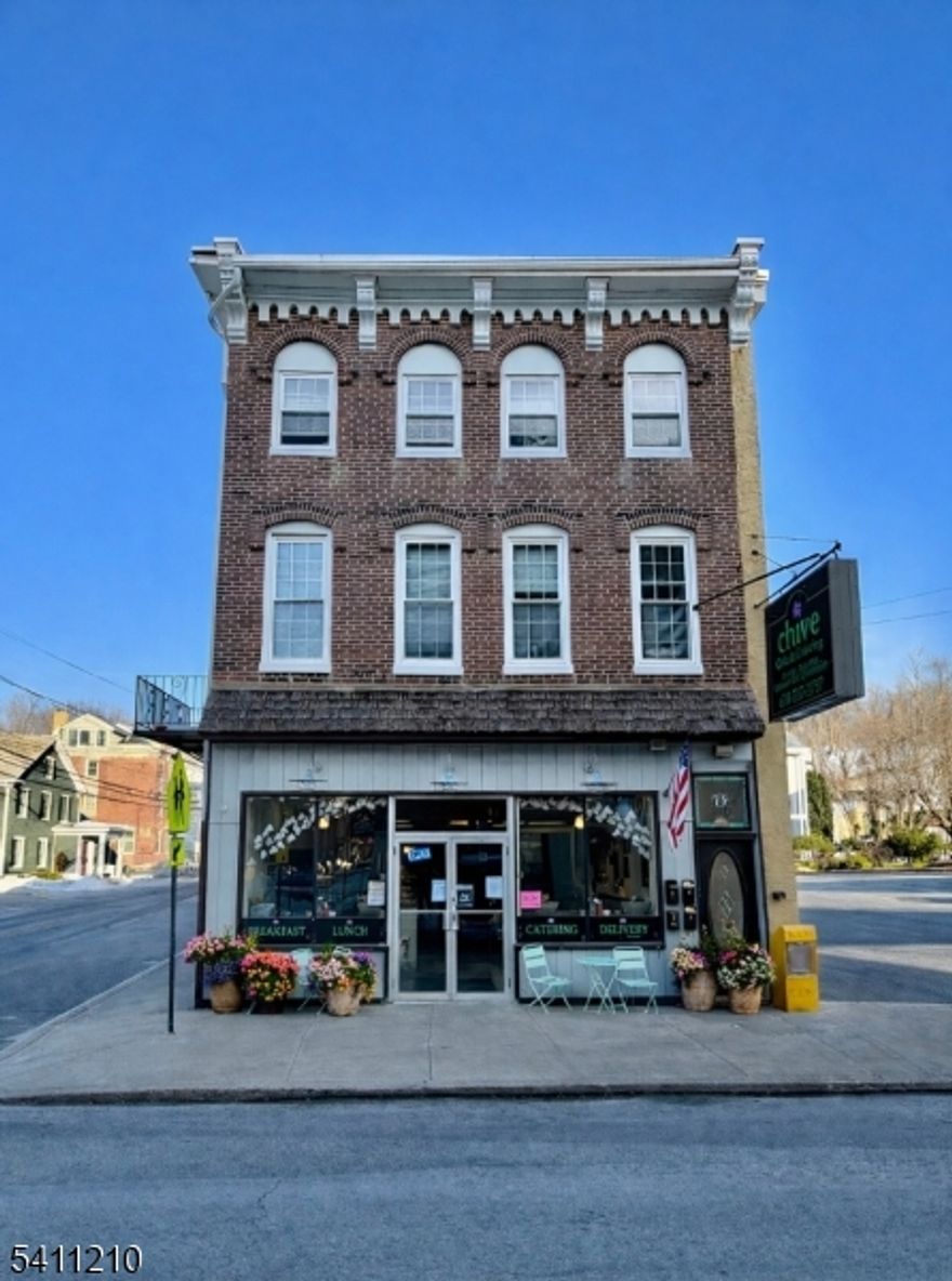 An exceptional investment opportunity in the heart of downtown Lambertville, featuring the highly popular Chive Caf  anchoring the ground floor and four income-producing residential units above. This well-positioned mixed-use property offers immediate cash flow and parking in one of Hunterdon County's most sought-after markets. Each apartment is filled with natural light and thoughtfully laid out to maximize comfort and rental appeal, attracting long-term tenants and consistent demand. The strong commercial presence below enhances overall stability, while the residential units provide diversified income streams. Located just steps from Lambertville's renowned dining, shopping, arts, and riverfront attractions, this property benefits from constant foot traffic and enduring tenant interest. Its proximity to New Hope and easy access to major commuter routes further strengthen its long-term value. Whether you are expanding an existing portfolio or seeking a high-performing asset in a prime downtown setting, this property delivers a rare combination of location, income potential, and long-term upside.