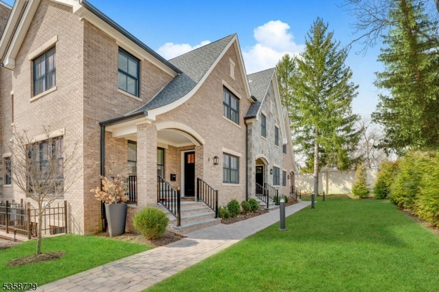 This exceptional sun-filled end unit offers thoughtfully designed living in one of Summit's most desirable locations, just moments from downtown. Purchased pre-construction, the home was fully customized in collaboration with a professional NYC designer, resulting in a refined and highly bespoke residence. A welcoming lounge with custom wet bar, ice maker and beverage refrigerator sets the tone upon entry. The open concept layout at the rear of the home boasts a chef's kitchen that impresses with custom cabinetry, quartz countertops, under-cabinet lighting and top-tier appliances, flowing seamlessly into an expansive great room with gas fireplace and access to the rear deck. Select areas are elevated with Venetian plaster and designer wallpapers, while white oak flooring and designer lighting fixtures add warmth and elegance throughout. The second floor features a serene primary suite with a custom walk-in closet and spa-like bath with digital shower system and private commode. Two additional bedrooms with en-suite baths and a laundry center completes the level. The top floor offers bonus space and storage, while the lower level includes a media room, full bath, mudroom, storage/utility room and access to the nicely outfitted two-car garage with separate entry door, epoxy flooring, storage cabinetry and slatwall panels. Additional highlights include designer tilework, custom storage, and a location just a few blocks from downtown Summit.