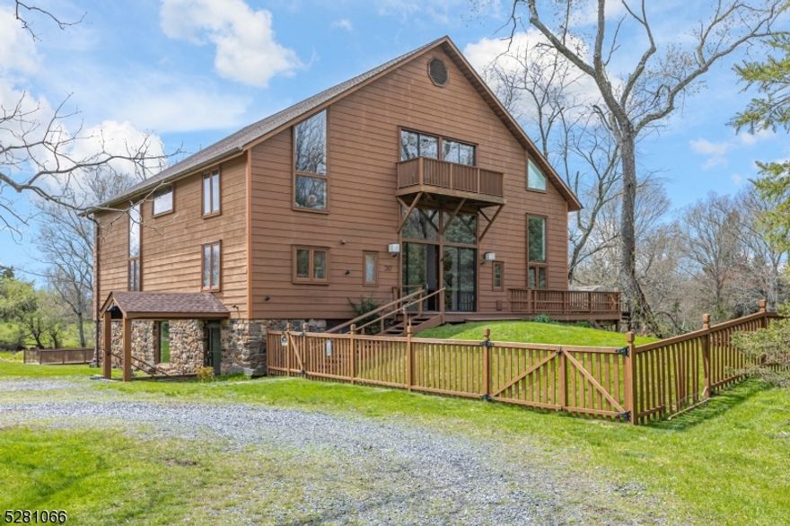 With the D&R Canal edging one side and preserved natural land bordering the 3 other sides, this peaceful, nearly 9-acre offering has that worlds-away country feel within 47 miles of NYC and 8 miles of Princeton. The masterfully converted bank barn has views of the working Christmas tree farm, on a lot of its own and adjacent to a pond and stream. Presenting the chance to live in one-of-a-kind comfort, the dramatic stone and clapBOArd barn is full of rustic contemporary allure thanks to the talents of renowned local architect, Jerry Ford. Huge beams accentuate soaring ceilings and oversized windows welcome in light and protected views of the grounds. Some space is wide open, ideal for gathering groups. A library, featuring floor-to-ceiling bookshelves, and a study with a reading nook, are cozy spots to escape. The upper bedroom suites are beyond spacious, while the ground floor offers guests the independence of a self-contained apartment. With three fireplaces, multiple decks and no neighbors in sight, this place is just as magical on a snowy day as it is on a starry night! Whether you dream of working the land or seek a dramatic rural getaway where all can convene comfortably, this property represents an extraordinary opportunity. come see!