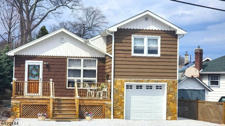 STEPS FROM LAKE HOPATCONG, BOASTING STUNNING, YEAR ROUND LAKE VIEWS!! ENJOY YOUR MORNING COFFEE OR EVENING NIGHTCAP WHILE RELAXING ON YOUR DECK GAZING AT THE BEAUTY OF LAKE HOPATCONG. DEEDED BEACH RIGHTS - ACCESS TO BEACH & DOCKS WITHIN WALKING DISTANCE OF HOME! NEWER 3BR SEPTIC! THIS MOVE-IN READY 3BED/1BATH LAKE-STYLE RANCH IS DECEIVINGLY SPACIOUS & WILL DELIGHT EVEN THE MOST DISCERNING OF BUYERS!! UPON ENTERING THIS GEM YOU WILL BE AMAZED BY THE FLOW OF THE HOMES LAYOUT, IDEAL FOR ENTERTAINING AND GATHERINGS. THE LIVING ROOM OVERLOOKS THE NEWER SPACIOUS FRONT DECK & FLOWS INTO THE EATING AREA AND KITCHEN. THE SPACIOUS PRIMARY SUITE BOASTS STUNNING LAKE-VIEWS, NEWER VINYL FLOORING, & BUILTIN CABINET STORAGE. THE TWO ADDITIONAL BEDROOM'S ARE ON THE MAIN LEVEL, BOTH GOOD SIZES & HAVE AMPLE CLOSET SPACE. THE LOWER LEVEL BOASTS A SPACIOUS FAMILY ROOM WITH VINYL FLOORING, BUILT-IN CABINETS & WORKSTATION. HIGHLIGHTS INCLUDE UPDATED BATH, UPDATED ELECTRIC; UPDATED FURNACE, SUMP PUMP, GARAGE DOOR, SEPTIC, FLOORING & SO MUCH MORE. VIEWS OF LAKE HOPATCONG FROM THE FRONT YARD, PRIMARY BEDROOM & DECK. WITH SOME PERSONAL TOUCHES THIS HOUSE CAN BE EASILY TRANSFORMED INTO YOUR FOREVER HOME OR YOUR SUMMER/WEEKEND RETREAT.  CLOSE TO THE CENTER OF TOWN, SCHOOLS, SHOPPING, LOCAL RESTAURANTS, OUTDOOR ACTIVITIES, MASS TRANSIT, MAJOR HWYS, & MORE. DO NOT MISS OUT ON THIS TREMENDOUS OPPORTUNITY.