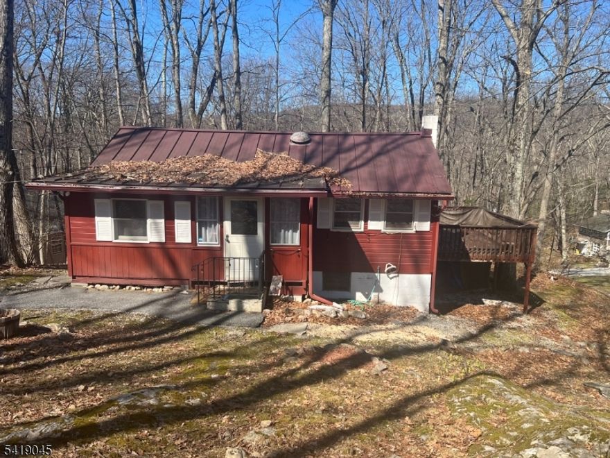 Now is the time to think about that Summer Retreat.  This is a Year Round Home but would make a Great Get-Away Cottage.  Enjoy all Lake Wallkill has to offer.  This Lake Community offers Lots of Fun Events throughout the Year.   The Home features a spacious Kitchen and Dining Area, Living Room, Two Bedrooms and a Full Bath.  The Basement is Home to the Utilities.  Deck and Patio are Perfect for Relaxing by the Fire or Entertaining. A Metal Roof is a True Bonus!   A New Septic will be Installed prior to Closing.