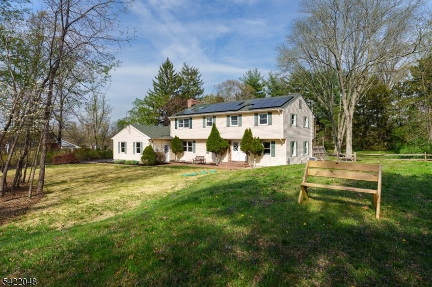 Just 3 miles from Princeton in Montgomery Township, this reimagined 5-bedroom home delivers the upgrades today's buyers are looking for. A 2022 renovation introduced a first-floor suite with its own bath and private entrance, offering flexibility for guests, extended stays, or a tucked-away workspace. Upstairs, a princess suite featuring a full bath, alongside a stunning primary suite. A newly designed bath showcases a Garden tub, oversized shower, sleek floating vanities, all overlooking a beautiful yard. Skylights pour in natural light, while a custom walk-in closet adds a serious wow factor. In total, three of the five bedrooms enjoy en-suite baths, while a well-placed hallway bath serves the remaining rooms.Second floor laundry is convenient. The open floor plan flows seamlessly into a standout kitchen, where quartz countertops, induction cooking, and exceptional storage elevate everyday meals. Large, newly expanded windows throughout the home bring in light at every turn, reinforcing the fresh, modern feel. The finished basement is ready for movie nights or game days with a built-in screen and surround sound. Practical upgrades have not been overlooked either: A newly updated septic system sized for 5 bedrooms, an electric vehicle charger in the garage, fully fenced yard. Thoughtful renovations and smart technology including owned solar panels and a new generator-ready electrical panel, plus versatile living spaces come together to create this amazing property!
