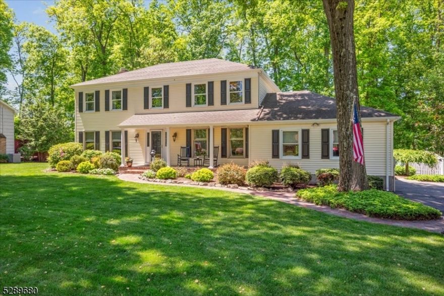 Classic Colonial Charm in a Tranquil Setting!  Old world charm and contemporary finishes effortlessly combine in this home with 4 bedrooms, 2.5 baths, 2-car garage and finished basement. This property sits on just over half an acre in a quiet residential neighborhood in Randolph with top schools and easy access to shopping, dining, parks, and highways. The main level features gorgeous hardwood floors and lots of architectural details, starting with a welcoming foyer flanked by a living room and a sunny formal dining room with lots of room to host dinner. An updated kitchen boasts rich wood cabinetry topped with granite, stainless steel appliances and sliding doors to a sprawling deck for easy entertaining. An adjacent breakfast area opens to a stunning family room with a fireplace and tall windows offering views of the backyard, perfect for grand entertaining or lazy-day relaxing. A laundry room and half bath complete this floor. A serene primary suite awaits upstairs with a large bedroom, private bath with dual vanity, and dressing room with vaulted ceiling and a wall of closets. Three more bedrooms are serviced by a full hall bath, and there's wood floors below the carpeting. The lower level houses a large recreational room and a bonus room/office. Enjoy your peaceful outdoor oasis with an oversized deck, stone patio and landscaped backyard surrounded by trees for incredible privacy an ideal setting for cookouts, gardening or sipping coffee and cocktails.