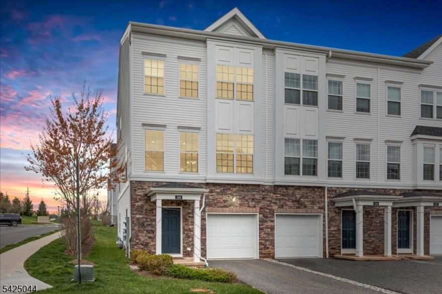 Welcome to 309 Saratoga Court, Branchburg, NJ, located in the Fox Hollow community. This end-unit townhome offers additional natural light, high ceilings, and an open-concept layout across multiple levels.The home features 2 bedrooms plus a den/office, 3 full bathrooms, and 1 half bathroom and attached garage. The second floor has Large windows brings lots of sunlight and an updated kitchen with stainless steel appliances, a large pantry, and ample cabinetry. The kitchen flows into the dining and living areas, with a sliding door providing access to a deck.Upstairs, the primary suite includes closet space and a private bathroom. A den/Office and a second bedroom and full bathroom complete the upper level.The finished lower level includes a full bathroom and flexible living space suitable for a recreation room, guest area, or workspace.Additional features include a water filtration system with reverse osmosis, EV charging capability, and overhead garage storage. Community amenities include a basketball court, playground, and gazebo.Conveniently located near major highways including Routes 22, 202/206, and I-287, as well as NJ Transit, shopping, dining, and parks.