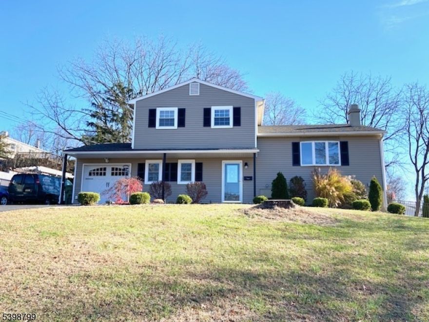 Fantastic Country Split-Level on a Spacious 0.4-Acre Corner Lot. This well-maintained home sits on a generous corner lot and features a fully fenced backyard with a maintenance-free deck, a large storage shed, and a paved driveway that can accommodate up to 10 cars. Exterior updates include newer siding, roof, and windows for peace of mind. Inside, you'll find a blend of hardwood, luxury vinyl, and carpeted floors, along with custom trim work and crown molding in many rooms. Enjoy a cozy wood-burning fireplace in the living room and a gas fireplace in the family room. The updated white kitchen offers stainless steel appliances, granite counters, hardwood flooring, and a stylish tile backsplash.The home is equipped with economical gas forced hot-air heat and a super-efficient wall-mounted gas hot water heater. The ground floor features a comfortable family room, and the basement includes an additional rec room perfect for extra living space, hobbies, or storage. Conveniently located near major highways, schools, and shopping. A wonderful place to come home to!