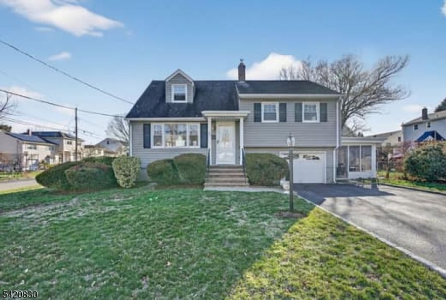 Welcome to this charming split-level home, perfectly positioned on a corner lot in the highly sought-after Patricia Place neighborhood of Clifton, New Jersey. This well-maintained home features 3 bedrooms 1.5 bathrooms, a sun-filled living room with a large picture window, dining room, and a functional kitchen. The finished basement provides versatile additional living space, complemented by an attached garage, enclosed porch, central air conditioning, and a beautiful side yard ideal for relaxing or entertaining. Conveniently located near public transportation, houses of worship, shopping, and parks, this home offers both comfort and accessibility. Come make this lovely house, your home!