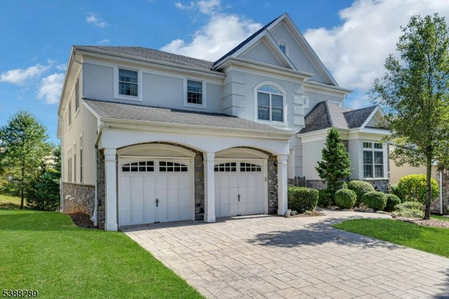 A rare opportunity to purchase a stately Warwick-style home with breathtaking water views on a cul-de-sac. This complete home offers a new handcrafted modern kitchen with a built-in pantry.  Most of the bathrooms have been updated with new cabinetry.   The primary bedroom suite is located on the first floor, along with an additional fourth bedroom that is adjacent to a full bathroom. The finished walk-out lower level is complete with a stunning wall of windows, a theater room, a full bathroom, and a 2nd kitchenette.  The deck has been replaced with a premium "Trek" deck material. The patio features a "water shed" (water does not penetrate to the patio from the deck). With all of its splendor, this home is complete with an elevator! This home offers a refreshing modern style that is simply beautiful.