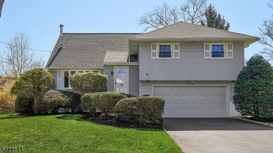 Location, Comfort & Beauty   Welcome Home to this Updated, Move-in Ready 4-Bedroom, 2.1 Bath Split, Tucked Away on a Quiet Street Just a Short Walk to Jefferson School. Bright, Open & Airy, the Main Level Features an Inviting Foyer, Newly Finished Gleaming Hardwood Floors, and Sun-Filled Living Spaces w/ Large 5-Panel Bow Window and Cozy Stand-Alone Fireplace Flows Seamlessly into the Dining Area and Updated Kitchen w/ Granite Countertops & New Stainless Steel Appliances. Upstairs, the Primary Suite Offers a Private Full Bath & Two Large Reach-In Closets, Along w/ Two Additional Generous Bedrooms and an Updated Hall Bath. The Top Level Features an Expansive 4th Bedroom Plus Ample Storage & Attic Access. It is Currently Being Used as a Home Office. Moving to Ground Level, an Updated Powder Room Access to the Oversized 2-Car Garage, Access to the Basement and a Large Family Room w/Direct Access to the Paves Patio Overlooking a Private Backyard - Ideal for BBQ & Gathering. The Full Basement w/ High Ceiling Offers Endless Potential for Future Living or Entertainment Space. Enjoy Easy Access to Jefferson Elementary, Tamaques Park, and NJ Transit to NYC, a Perfect Blend of Suburban Comfort & Everyday Convenience. Thoughtful Updates Throughout Provide Peace of Mind, Including Hot Water Heater(2023), Roof (2021), Driveway (2019), Windows (2018), Central AC (2017).