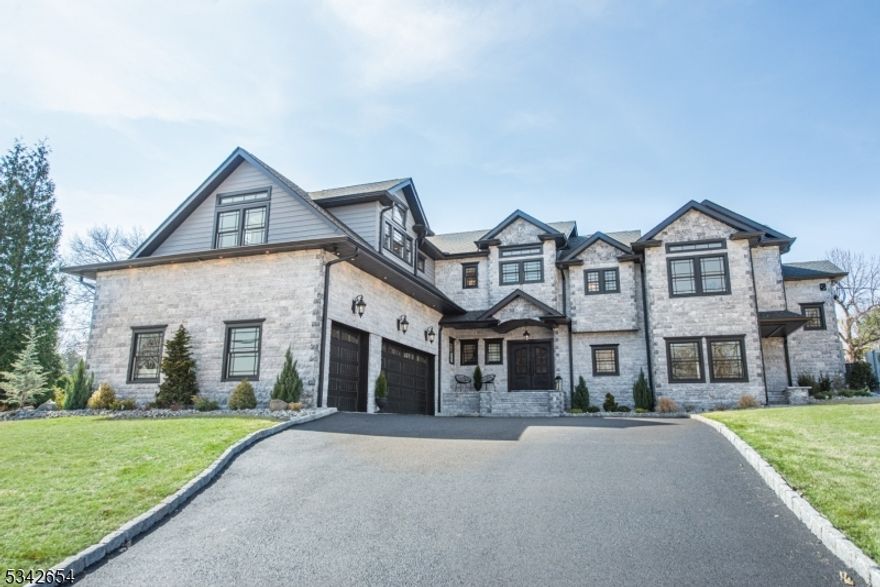 This newly constructed stately home blends custom details w exquisite finishes. Its unique layout boasts grand open spaces perfect for gatherings, while maintaining a cozy, relaxed ambiance for everyday living. Step through the central foyer, into a chef's kitchen that dreams are made of. Custom cabinets, high-end appliances, a walk-in pantry, & an oversized island create a culinary haven that flows into the open dining room & family room where you can savor breathtaking sunset vistas over the lush private lawn. Panoramic windows bathe the gracious living room in sunlight while multiple outdoor patios beckon for al fresco dining & celebrations. A secluded home office provides a tranquil workspace, & two staircases ensure a perfect circular flow. Ascend to the main wing, where the primary bedroom awaits w soaring ceilings, a WIC & a luxurious spa-like bath featuring heated flrs, a soaking tub & a walk-in shower for two. Two add'l bedrms share an elegant Jack & Jill bath, while a separate wing offers guests a spacious bedroom w an ensuite bath & an adjacent cozy den or fifth bedrm w another private bath. Convenience is key w a stylish laundry room & dedicated pet spa. The expansive bsmnt offers endless possibilities for fitness, wine storage or game-day gatherings. An oversized three-car garage adds the final touch of luxury. Perfectly situated to enjoy the highly rated West Essex schools, parks, town pool, shops & restaurants, this home is sanctuary where memories are made.