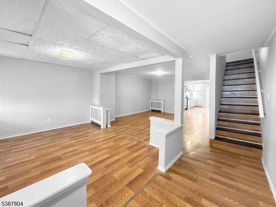 Turnkey investment opportunity with immediate cash flow! This renovated 3-bedroom, 1.5-bath end unit row house is the perfect addition to any portfolio. Tenant in place paying $1,850/month with tenant covering all utilities providing strong, low-maintenance income from day one. Renovated in 2026, the property features an updated kitchen with ample cabinetry and modern finishes, spacious open living and dining areas with updated flooring, and a mostly finished attic offering additional usable space. Full unfinished basement provides storage and future potential. Enjoy a private backyard and shared garage access. Low annual taxes of just $2,548 maximize your return. Ideal for investors seeking a turnkey, income-producing property with immediate cash flow.