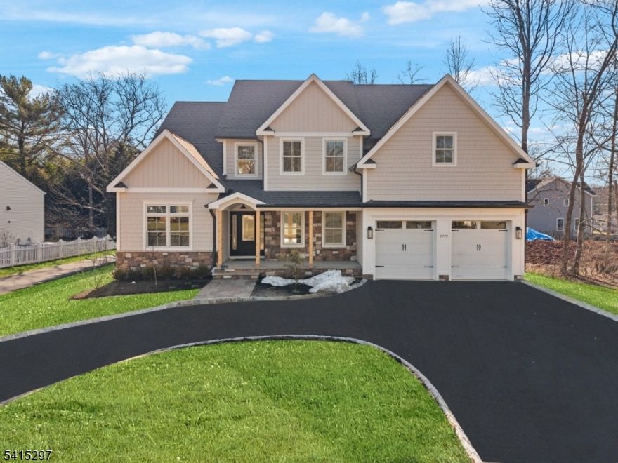 This stunning new construction home perfectly blends luxurious, thoughtful design on a spacious property with a circular drive. The heart of the residence is a chef-inspired kitchen, featuring a generous layout with ample custom cabinetry, expansive counter space, a dedicated walk-in pantry, and a suite of gleaming stainless steel appliances. The main level also provides ideal flexibility with a private first-floor bedroom and accompanying full bath. Upstairs, the opulent primary suite serves as a true sanctuary, boasting a dedicated sitting room with a volume ceiling, a extensive  closet, and an amazing spa-like bath highlighted by a dramatic volume ceiling, a deep soaking tub, a substantial glass shower, and a Toto bidet. The finished basement dramatically expands the functional living area, offering a spacious recreation room, a quiet home office, and another full bath, while the home's premier location-just 1.2 miles from both the train and bus lines. Also close by are the YMCA, JCC, downtown and the Fanwood library.  RWC 10 Year Home Warranty.